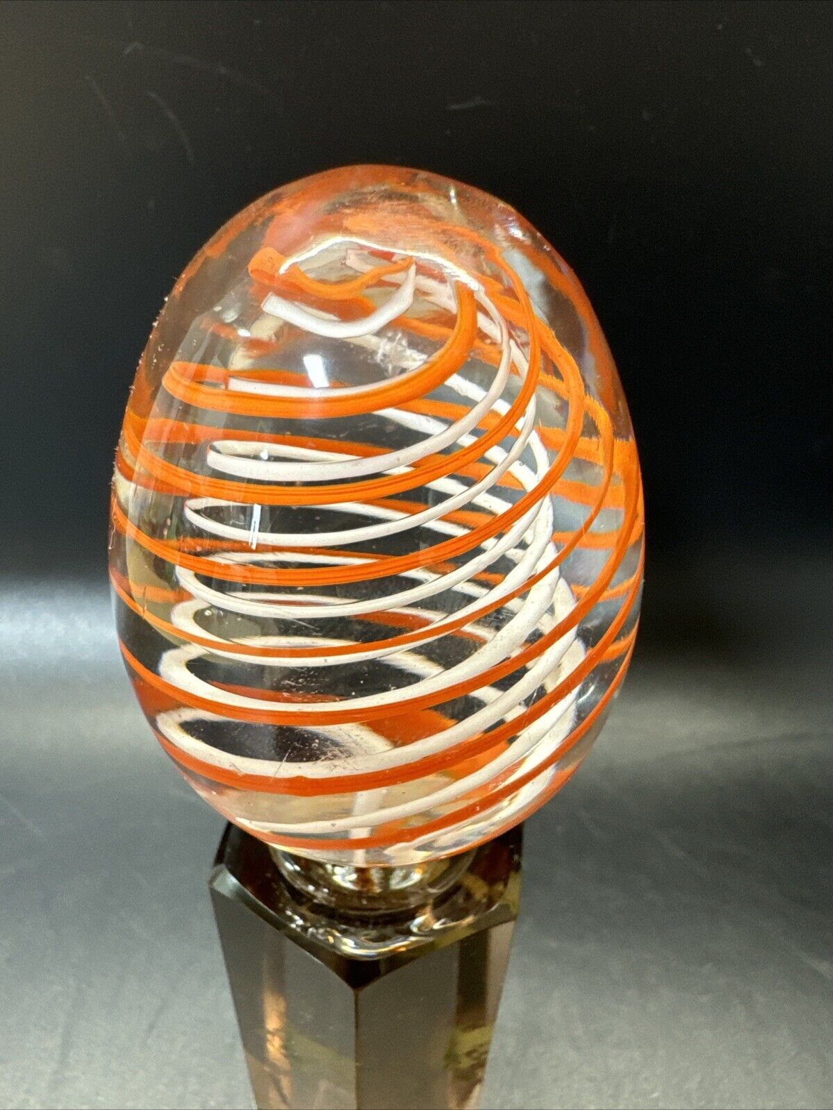 Contemporary White and Orange Core Spiral Marble On The Stand
