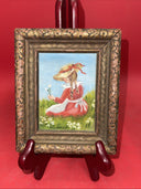 Small framed painting signed by the artist, oil on canvas "Girl picking flowers”