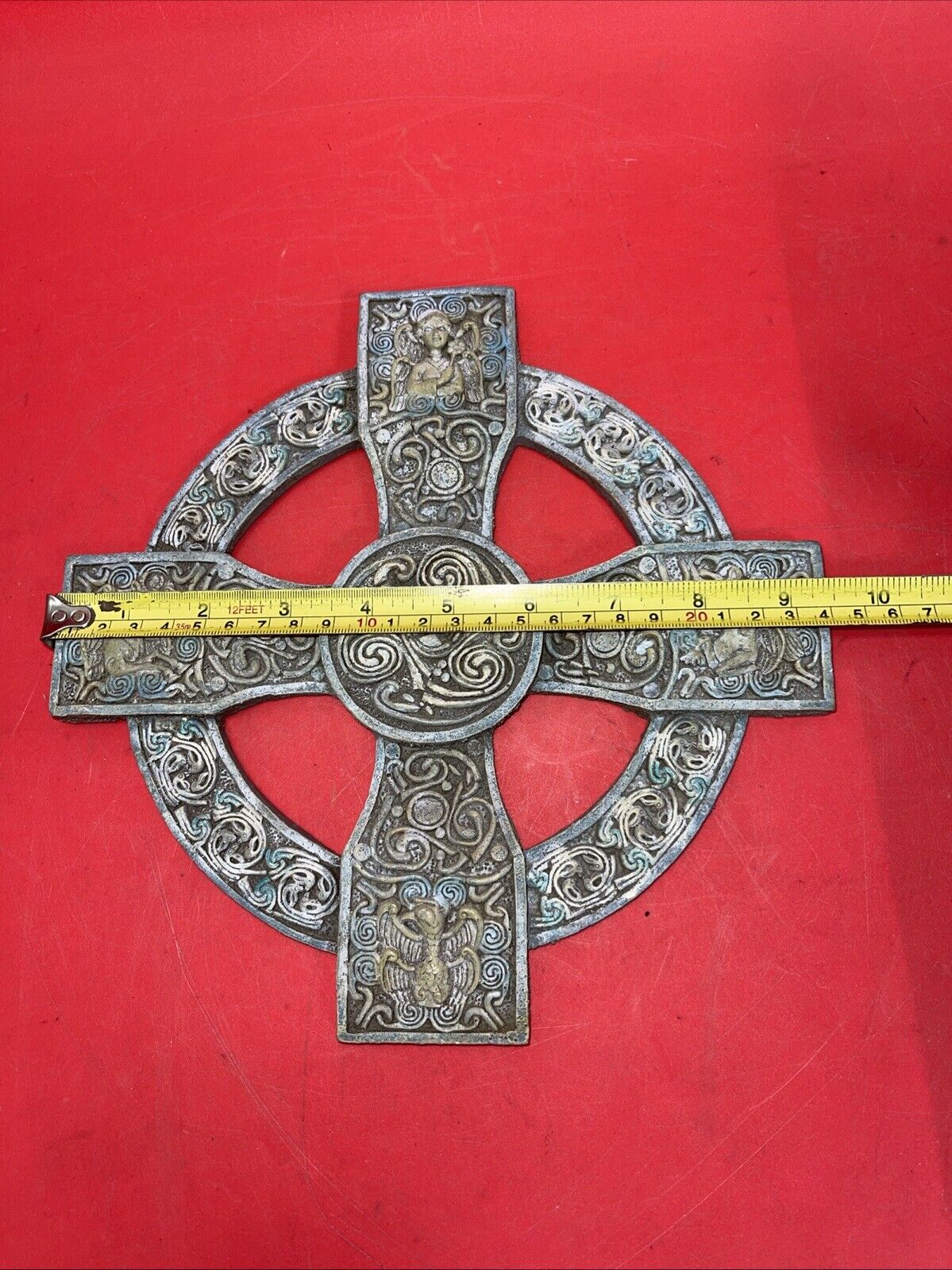 Unique antique round cross with an image of an angel and a unicorn