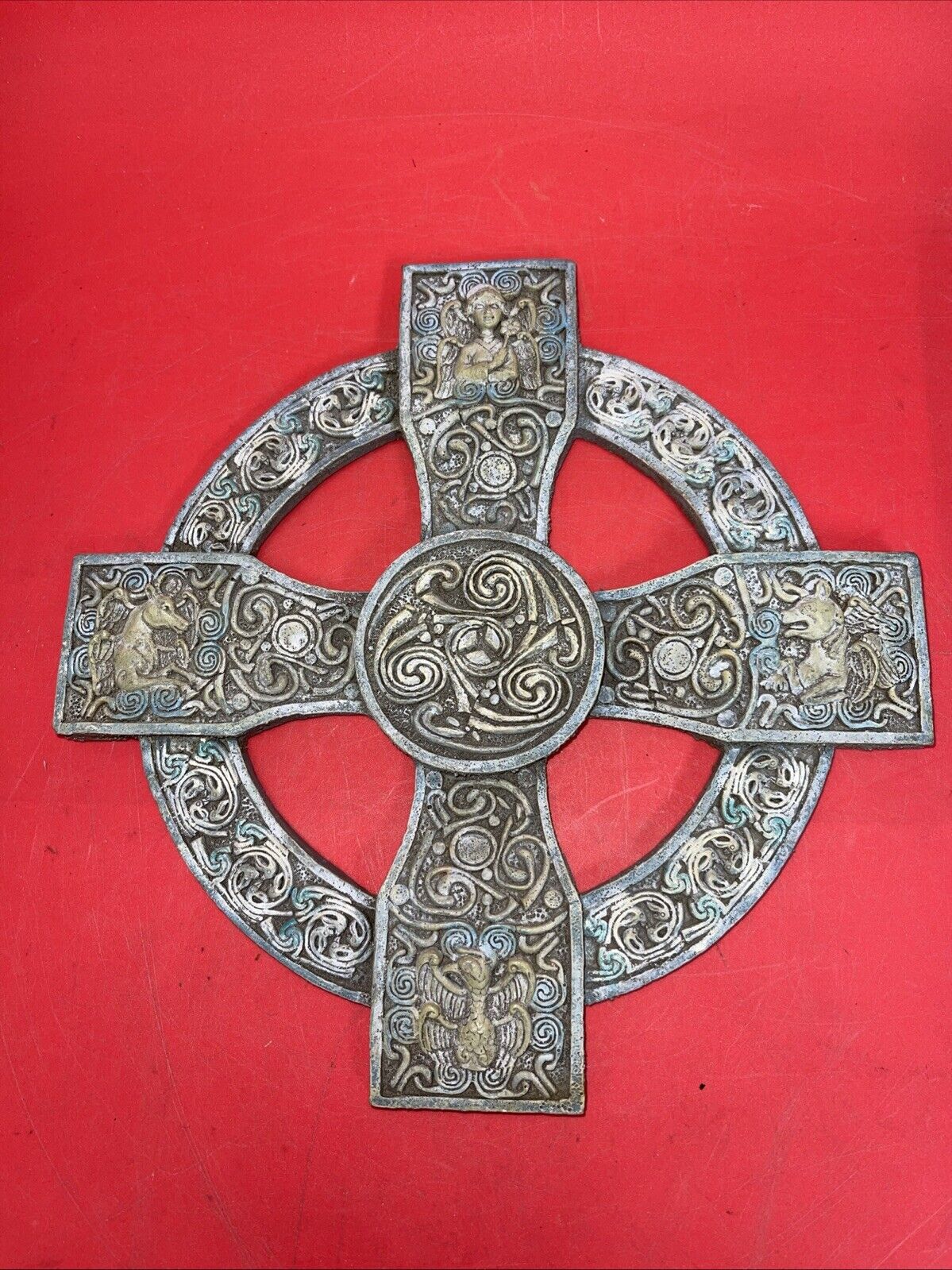 Unique antique round cross with an image of an angel and a unicorn