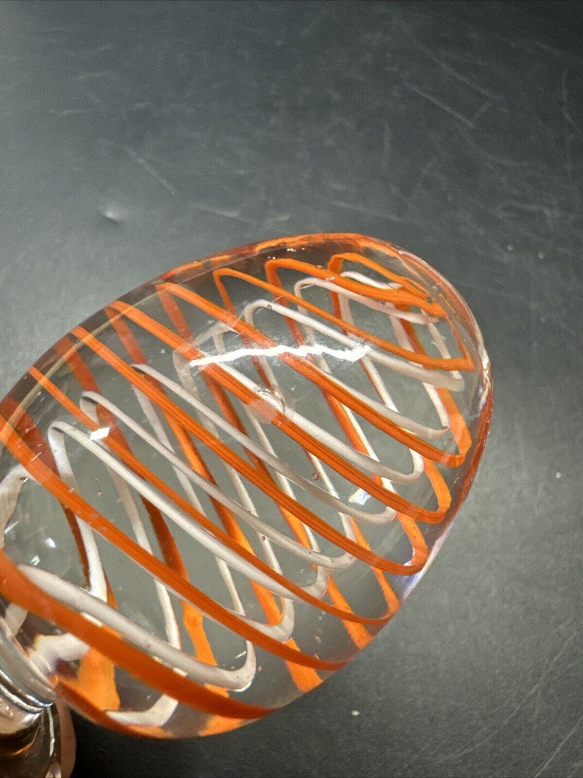 Contemporary White and Orange Core Spiral Marble On The Stand