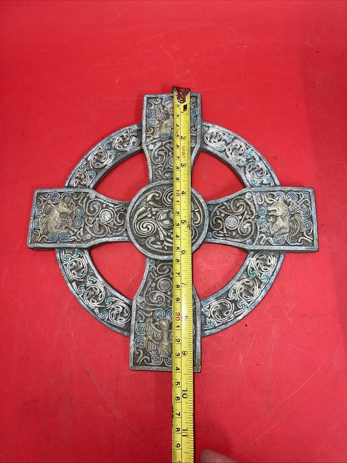 Unique antique round cross with an image of an angel and a unicorn