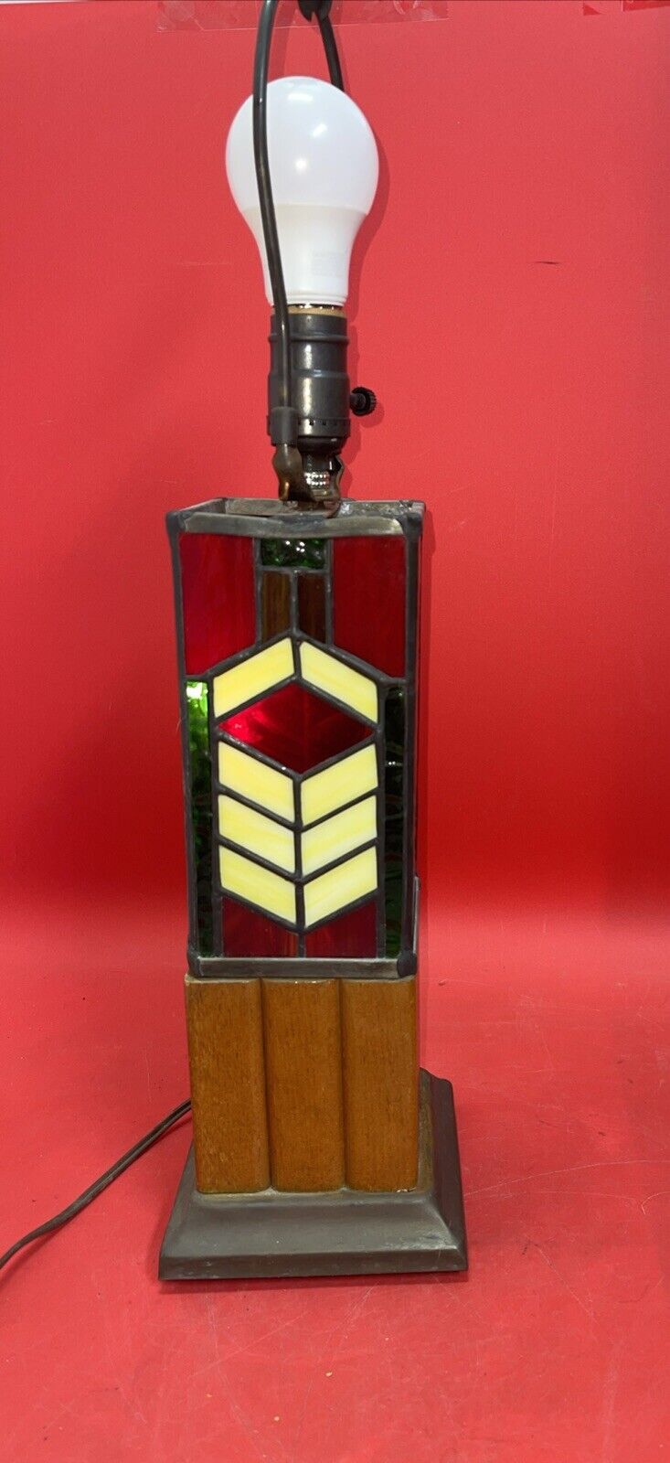 Tiffany style stained glass lamp with geometric pattern on the base