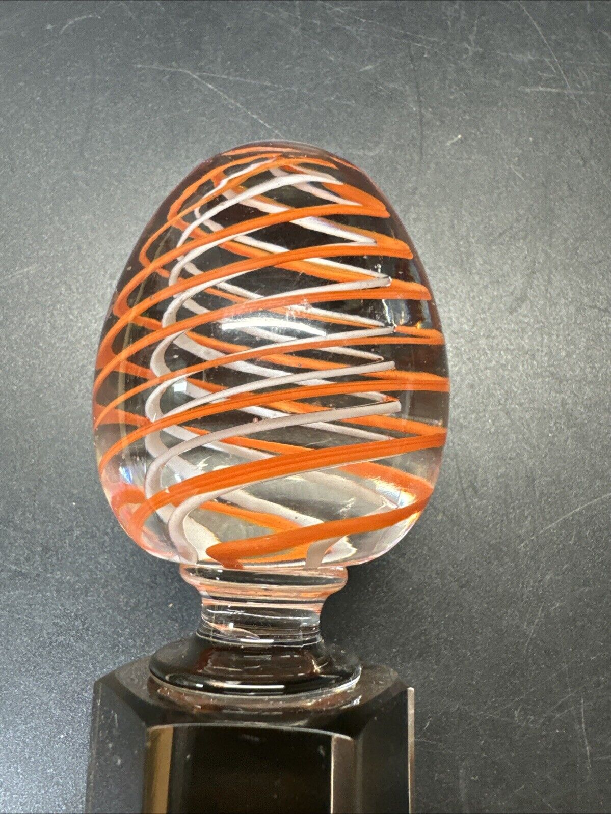 Contemporary White and Orange Core Spiral Marble On The Stand
