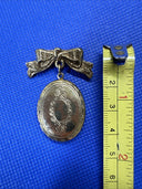 Vintage 1928 Jewelry Bow with Locket Dangle Gold Tone Brooch