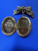 Vintage 1928 Jewelry Bow with Locket Dangle Gold Tone Brooch