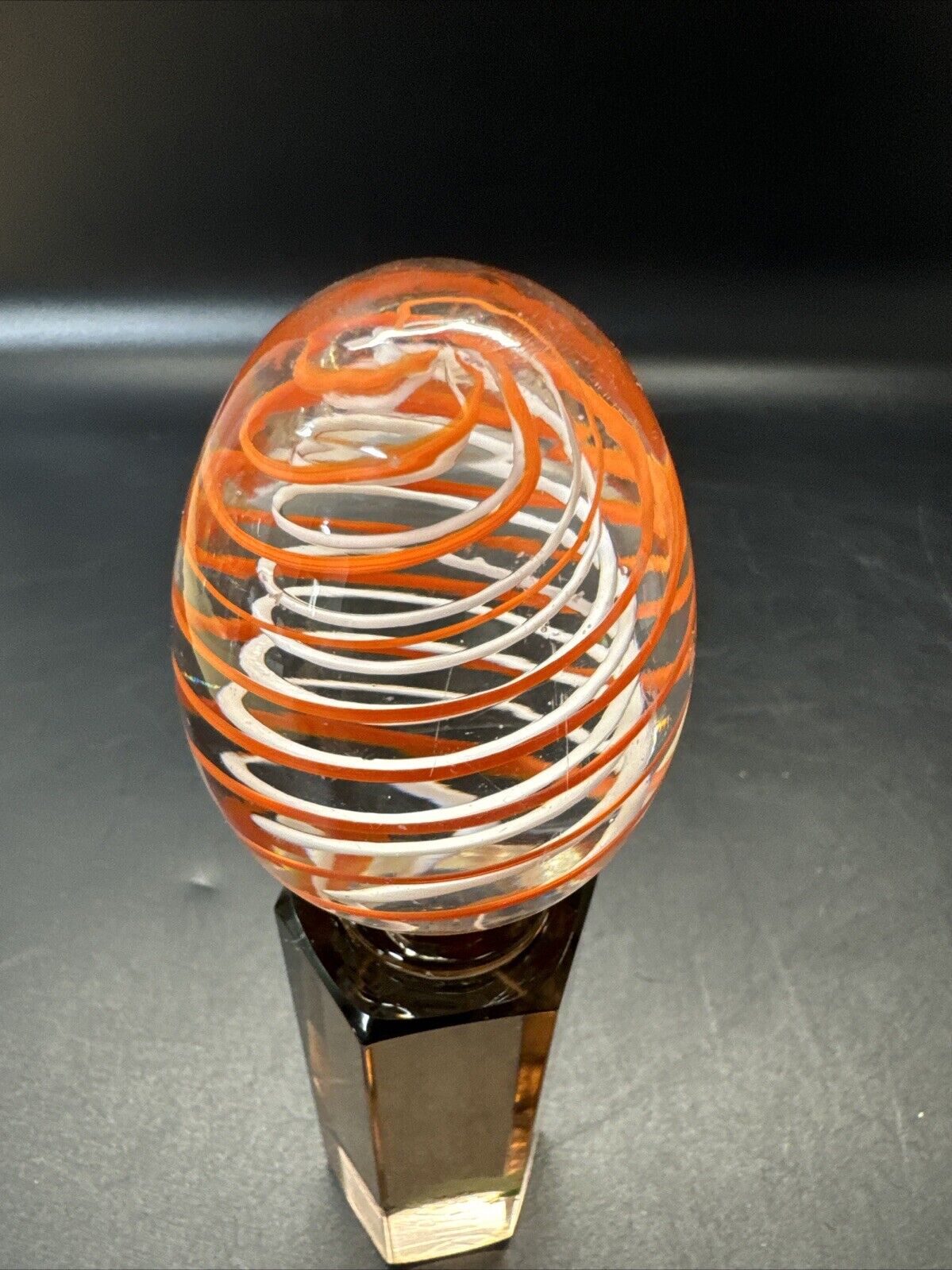 Contemporary White and Orange Core Spiral Marble On The Stand