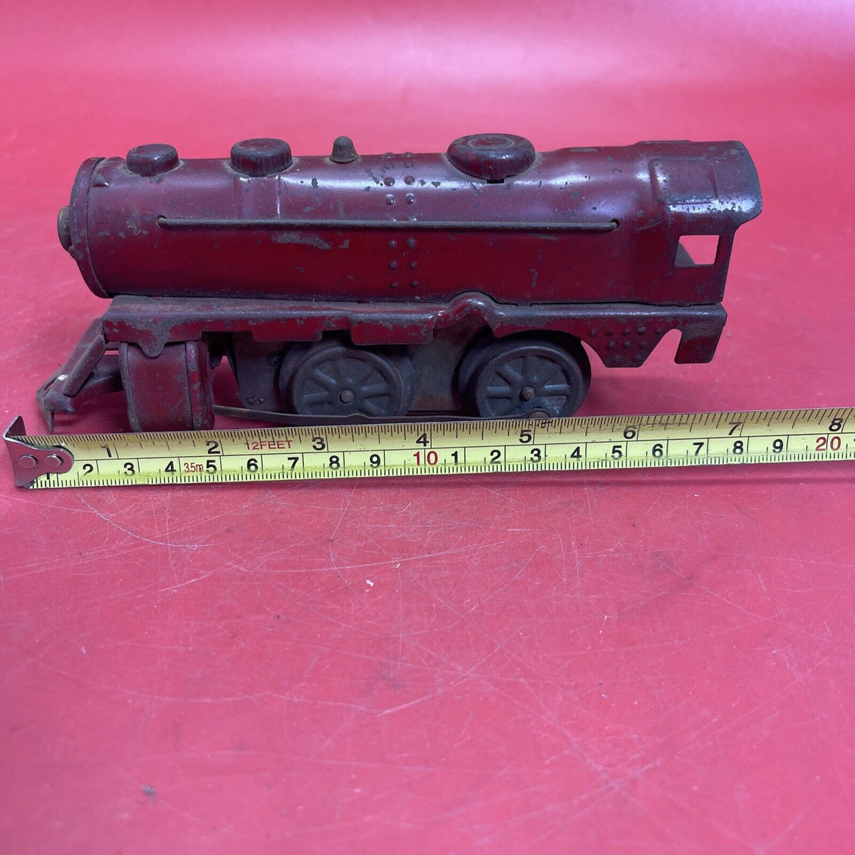 Vintage red locomotive, winding mechanism key