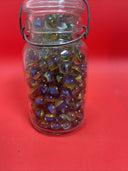 Vintage  Glass Ball Ideal Jar Filled With Marbles.  Jar Is 7” Tall.