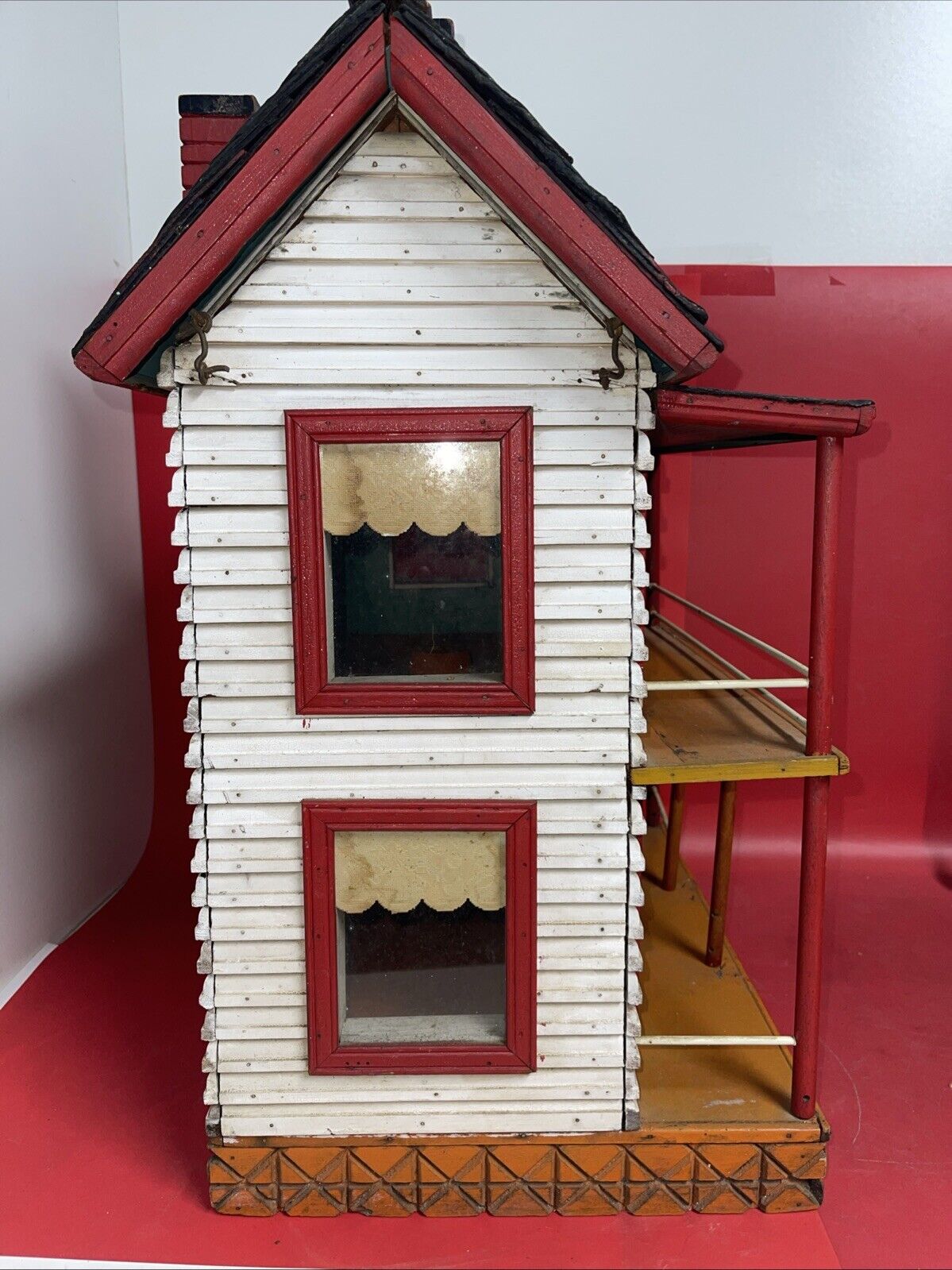 Vintage wooden dollhouse, two-story. Windows - red, removable roof