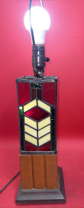 Tiffany style stained glass lamp with geometric pattern on the base