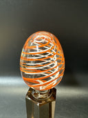 Contemporary White and Orange Core Spiral Marble On The Stand
