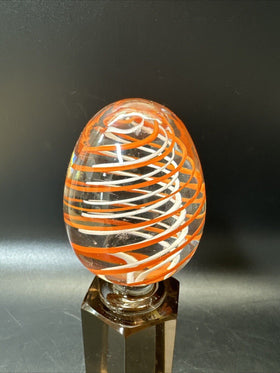 Contemporary White and Orange Core Spiral Marble On The Stand