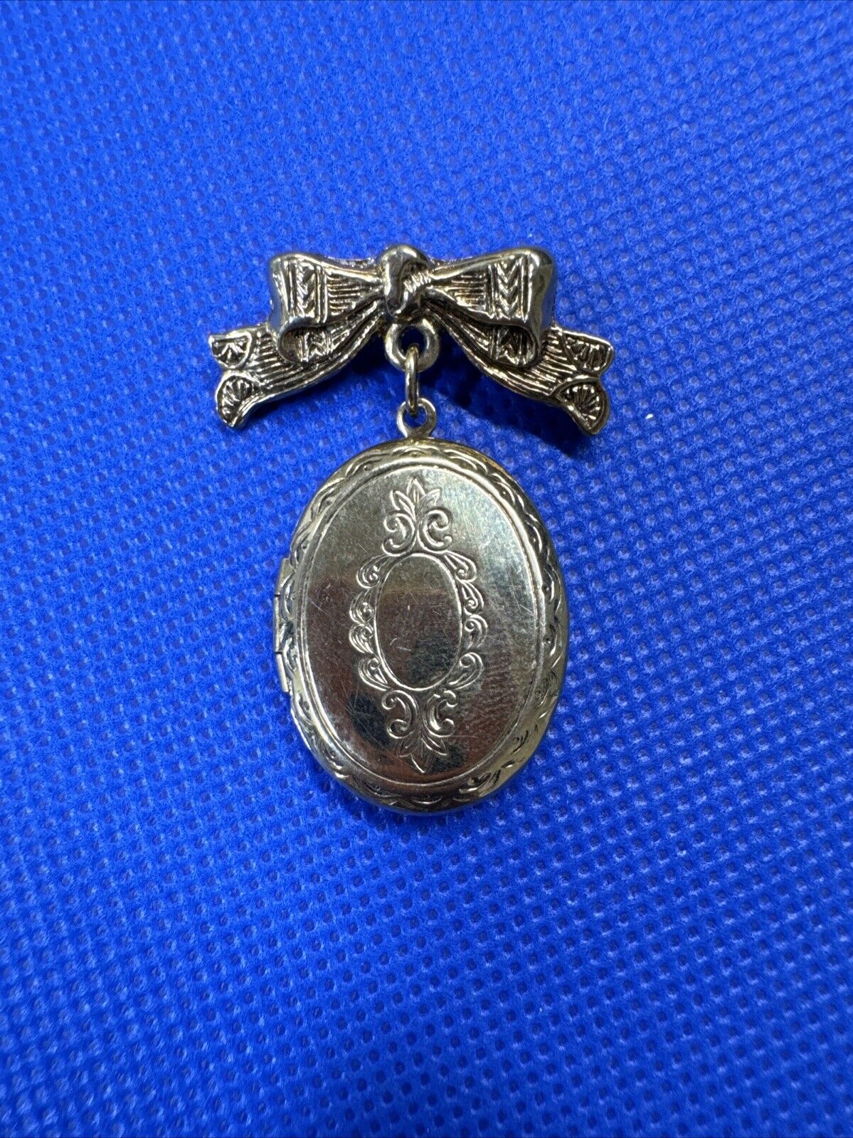 Vintage 1928 Jewelry Bow with Locket Dangle Gold Tone Brooch