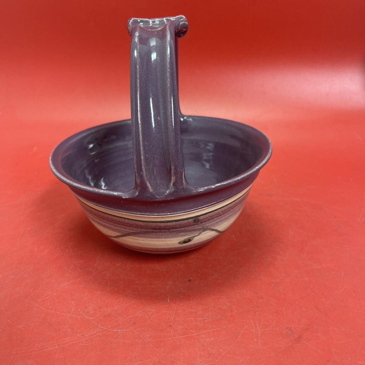 Ceramic basket with handle