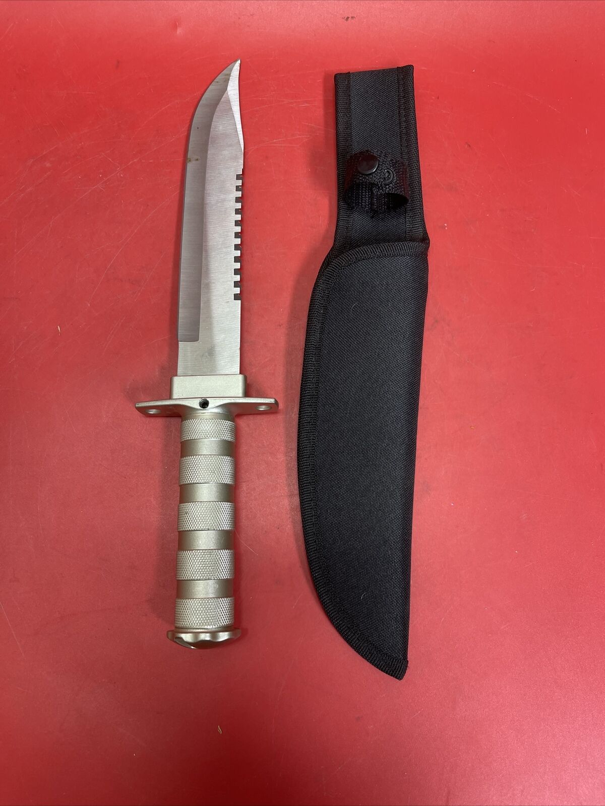 Knife with compartment in handle 8 1/2" blade and Saw type blade on the spine