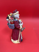 Santa Claus figurine with reindeer, duck and bag of gifts