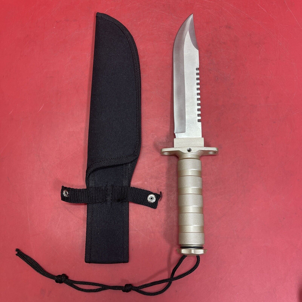 Knife with compartment in handle 8 1/2" blade and Saw type blade on the spine