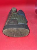 Vintage An ancient folk wood carving depicting a seated figure with a bird.