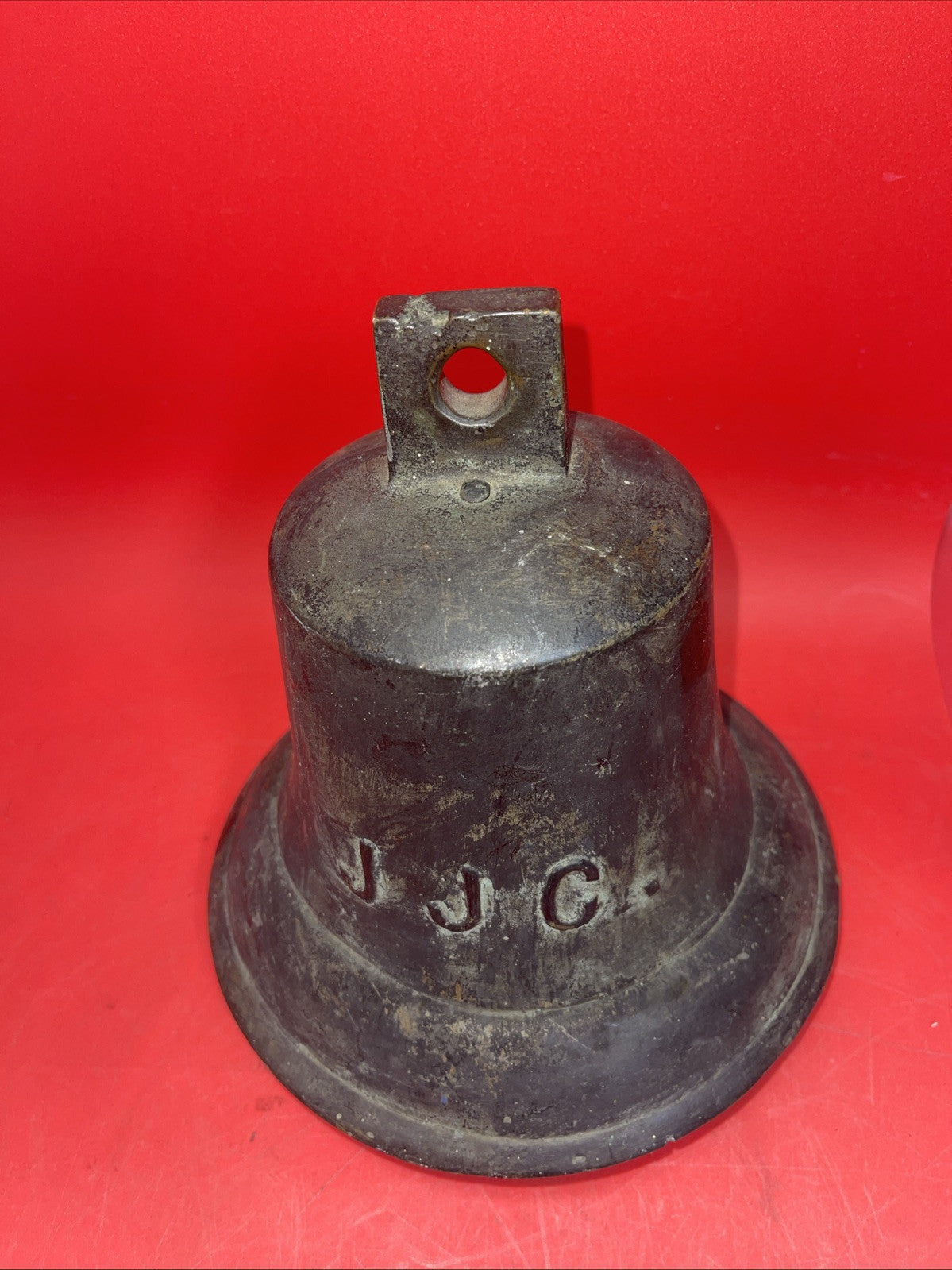 Antique naval bell with the inscription JJC