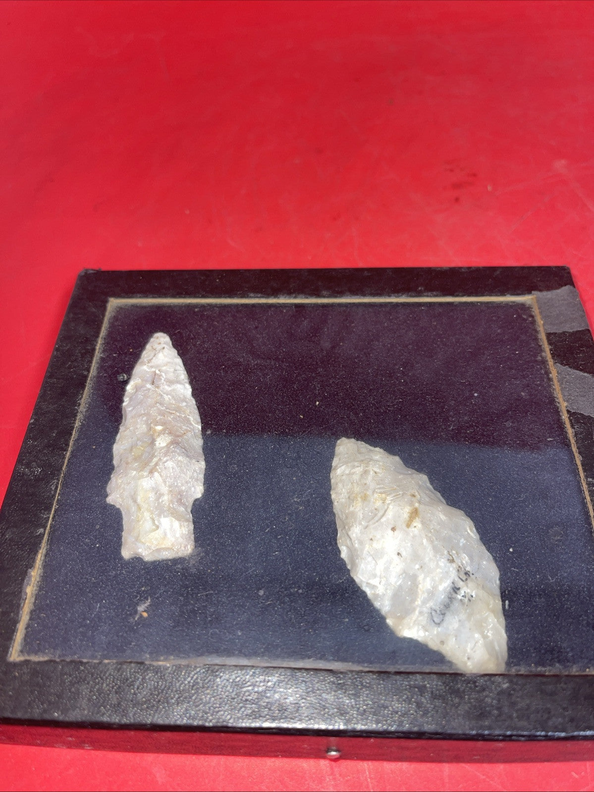 Native American Arrowheads collection in glass case, framed.