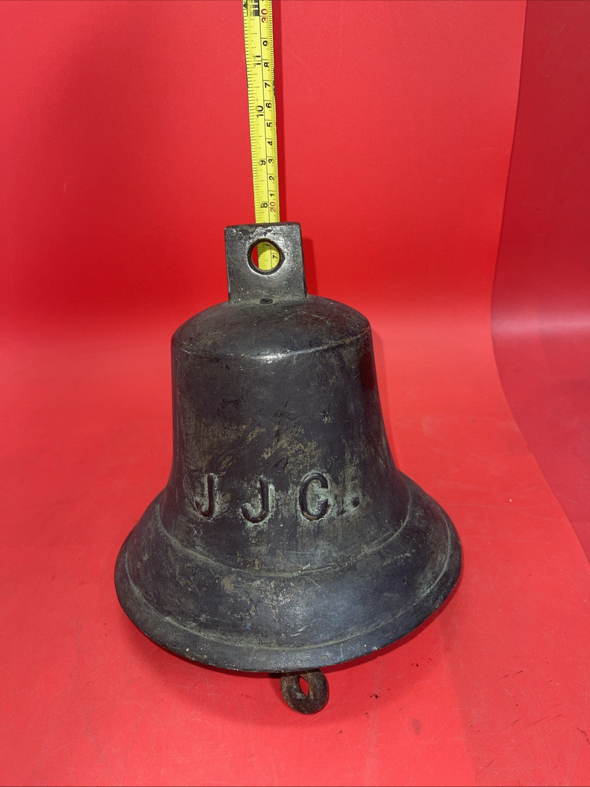 Antique naval bell with the inscription JJC