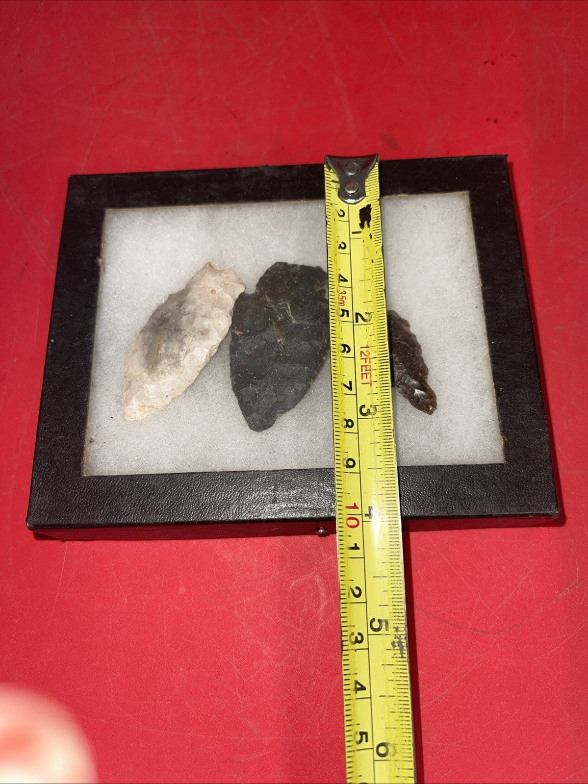 Native American Arrowheads collection in glass case, framed.