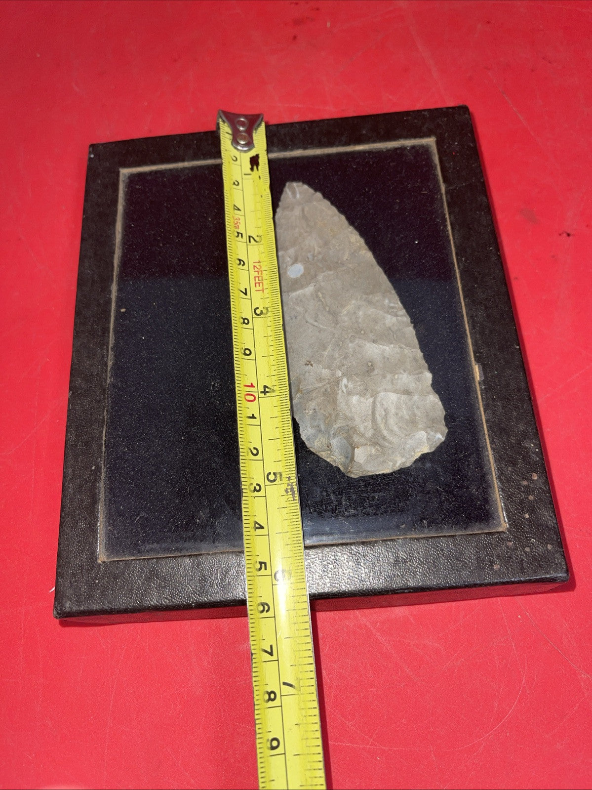 Native American Arrowheads collection in glass case, framed.